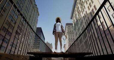 Carefree Young African Woman Walking on Bridge Enjoying Life Outside video