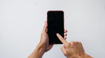 man holding smartphone with on white background. Space for text photo