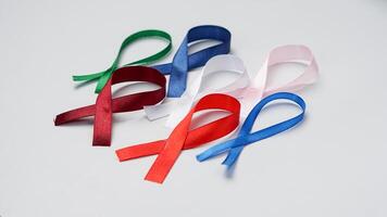 Colorful ribbons on white background, World Cancer Day photo