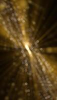 Vertical video - golden glitz and glamour background animation with flowing glittering gold bokeh particles and shimmering light rays. This glitzy motion background is full HD and a seamless loop