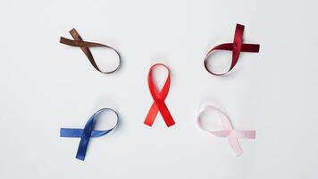 Colorful ribbons on white background, World Cancer Day photo