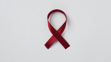 red ribbon on white background photo