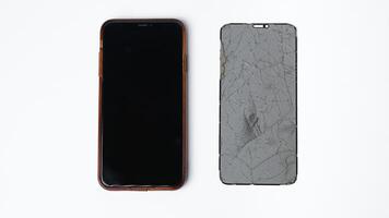 photo of smartphone with broken touchscreen display on white background