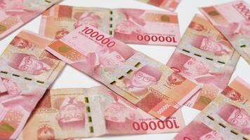 photo from Series of Indonesian rupiah banknotes worth one hundred thousand rupiah 100,000. Indonesian currency