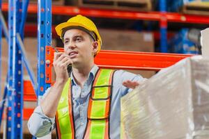 Foreman worker working in factory warehouse, Manager man in a warehouse, Warehouse worker checking inventory in warehouse photo