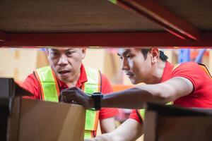 Foreman worker working in factory warehouse, Manager man in warehouse, Warehouse worker checking inventory in warehouse photo