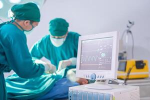 Medical team performing a surgical operation in operating Room, Concentrated surgical team operating a patient photo