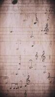 Vertical video - vintage sheet music notation manuscript with staff lines and musical notes moving gently across the sheet. This retro, grunge styled motion background is a seamless loop.