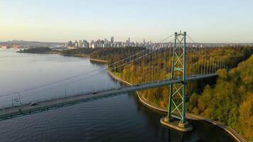 Aerial view of Lions Gate Bridge and Stanley Park at dawn. Canada video