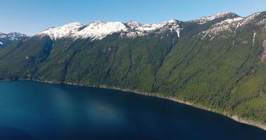 Aerial landscape view of Chilliwack Lake and mountains in spring. video