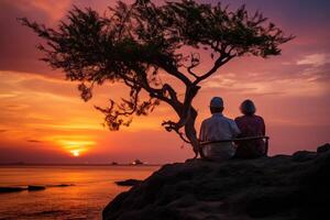 ai generado silueta de un mayor Pareja esperando para un vistoso puesta de sol sentado por el Oceano foto