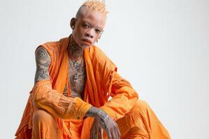 AI generated Portrait of an African man with tattoos on his face in orange clothes on a white background photo