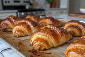 ai generado delicioso recién horneado croissants untado fuera en un horneando bandeja foto