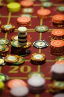 close-up of chips on the gaming table in a roulette casino photo