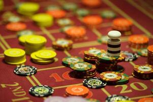 close-up of chips on the gaming table in a roulette casino photo