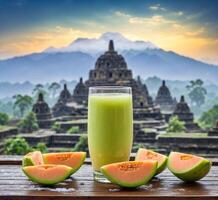 AI generated Glass of melon juice and fresh melon on the wooden table with sunrise background photo