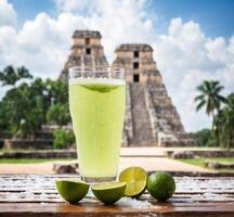 AI generated Green smoothie with lime in Chichen Itza, Yucatan, Mexico photo