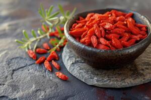 AI generated Fresh Goji berries on dark rough stone table. photo