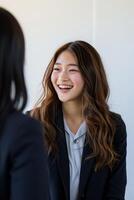 AI generated Young Japanese smiling woman in jacket. Business friendly negotiations photo