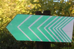 sign with arrows indicating the direction in the cycle and pedestrian path photo