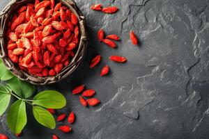 AI generated Fresh Goji berries on dark rough stone table. photo