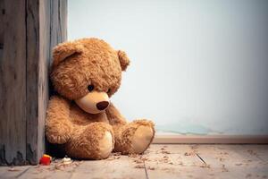 AI generated Heartfelt emotion Alone and disappointed, childs teddy bear against wall photo