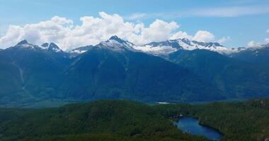 Aerial view on lake hidden somewhere in mountains near Whistler video