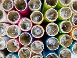 Samples of cloth and fabrics in different colors found at a fabrics market photo