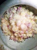 a bowl filled with onions and other vegetables photo
