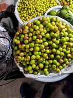 a bunch of green apples on a table photo