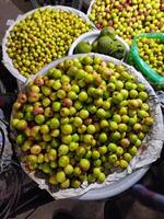 a bunch of green apples on a table photo