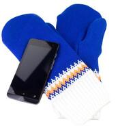 blue and white knited mittens with cellphone isolated on white background photo