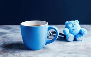 AI generated Blue bear with cup of coffee on blue background. Blue monday concept. Generative AI photo