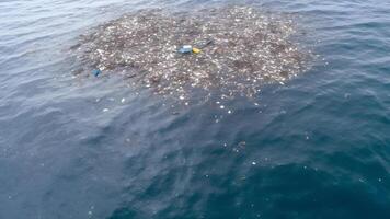 AI generated plastic garbage floating on ocean surface at daylight, neural network generated image photo