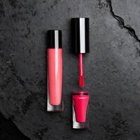 AI generated Lipstick gloss mockup on grange stone background, cosmetic mock up photo