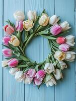 AI generated Spring wreath made with tulips isolated on blue wooden background. photo