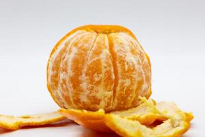 Closeup of a tangerine on a white background photo