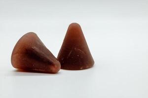 Closeup of cuberdon, a cone-shaped Belgian candy on a white background photo