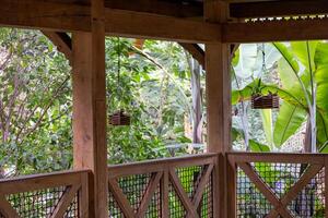 A wooden gazebo with baskets photo