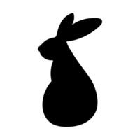 Silhouette of an Easter bunny isolated on a white background. Vector illustration of a rabbit for design use. Easter symbol. Holiday decor.