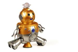 Golden toy robot isolated on white background. Dear vintage robot. Robotics. photo