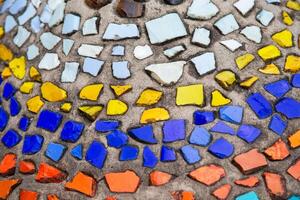 Mosaic panel made of multi-colored pieces of ceramics. Background inlay, mosaic photo