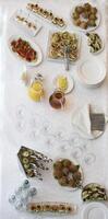 Food for a buffet on the table top view. Snacks. A festive table with dishes and drinks. photo