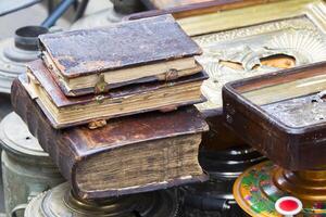 Ancient books. Antiquarian literature sold on the market photo