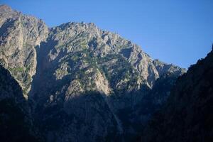 Mountain range against the blue sky. photo