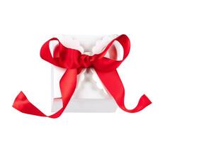 Gift box with red bow isolated on white background. Gift, discount photo