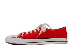 One red sneaker close-up on a white background, top view.Trendy shoes photo