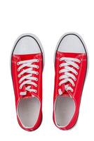 rojo zapatillas de cerca en un blanco fondo, parte superior vista. foto