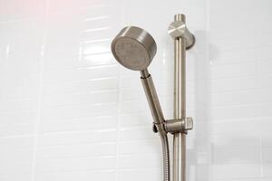 Hand Shower is a device for making showering more convenient. This shower is easy to install and can be removed from the stand for independent use. photo