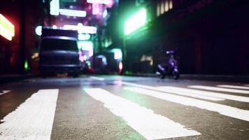 A vibrant city street illuminated by the lights of the night video